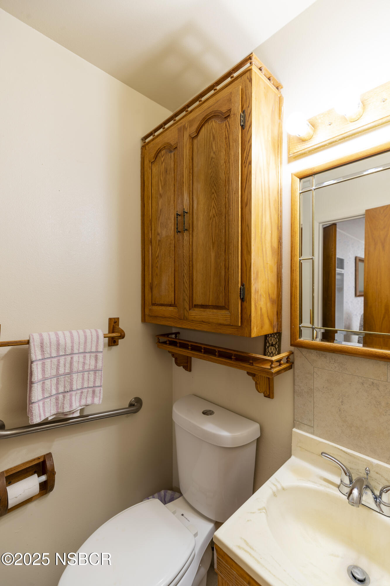 3361 Via Elba Lompoc, CA 93436 - Photo 22 of 40 a bathroom with a sink a toilet and shower curtain