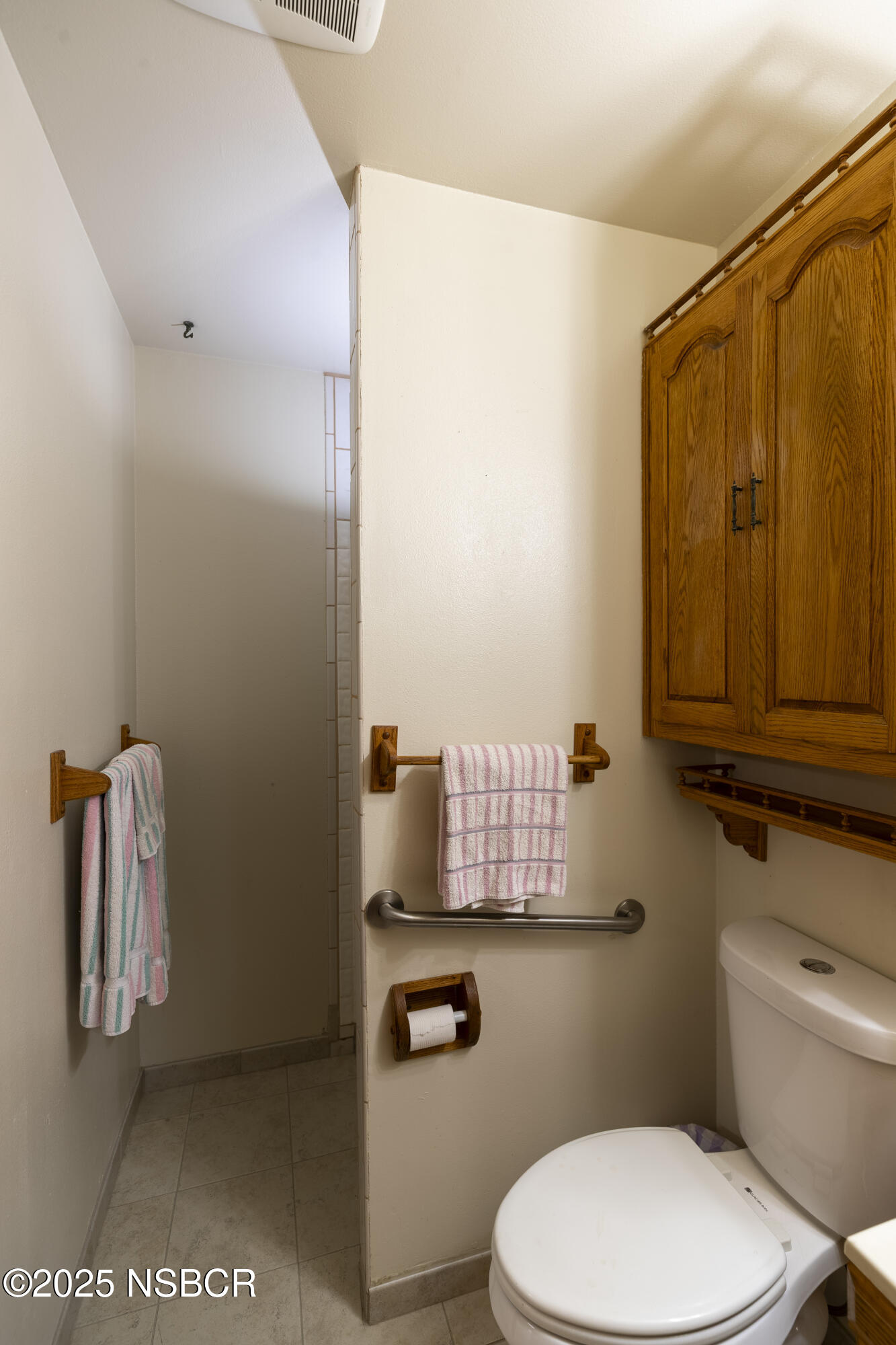 3361 Via Elba Lompoc, CA 93436 - Photo 23 of 40 a bathroom with a toilet sink vanity and mirror