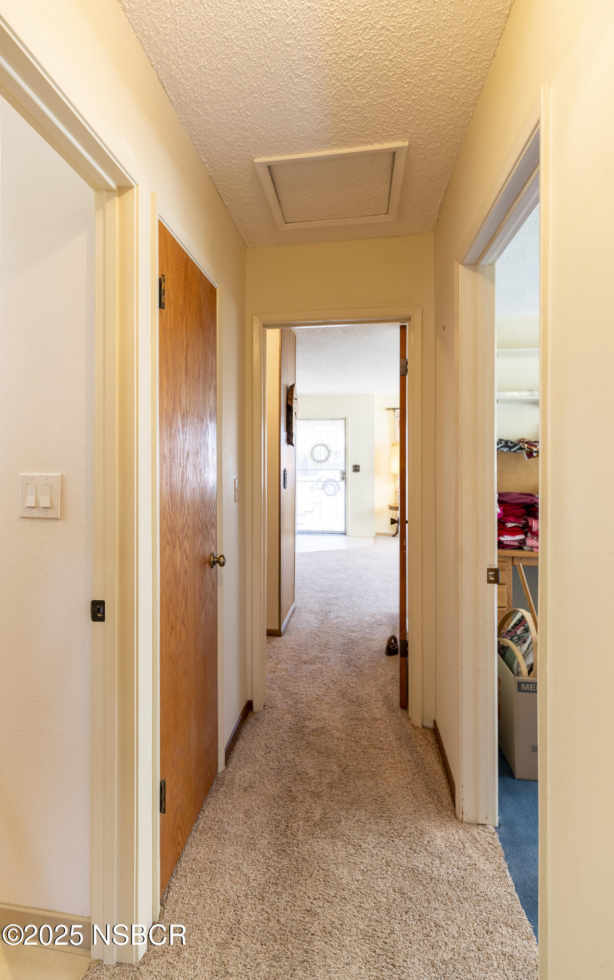 3361 Via Elba Lompoc, CA 93436 - Photo 26 of 40 a view of a hallway with wooden shelves