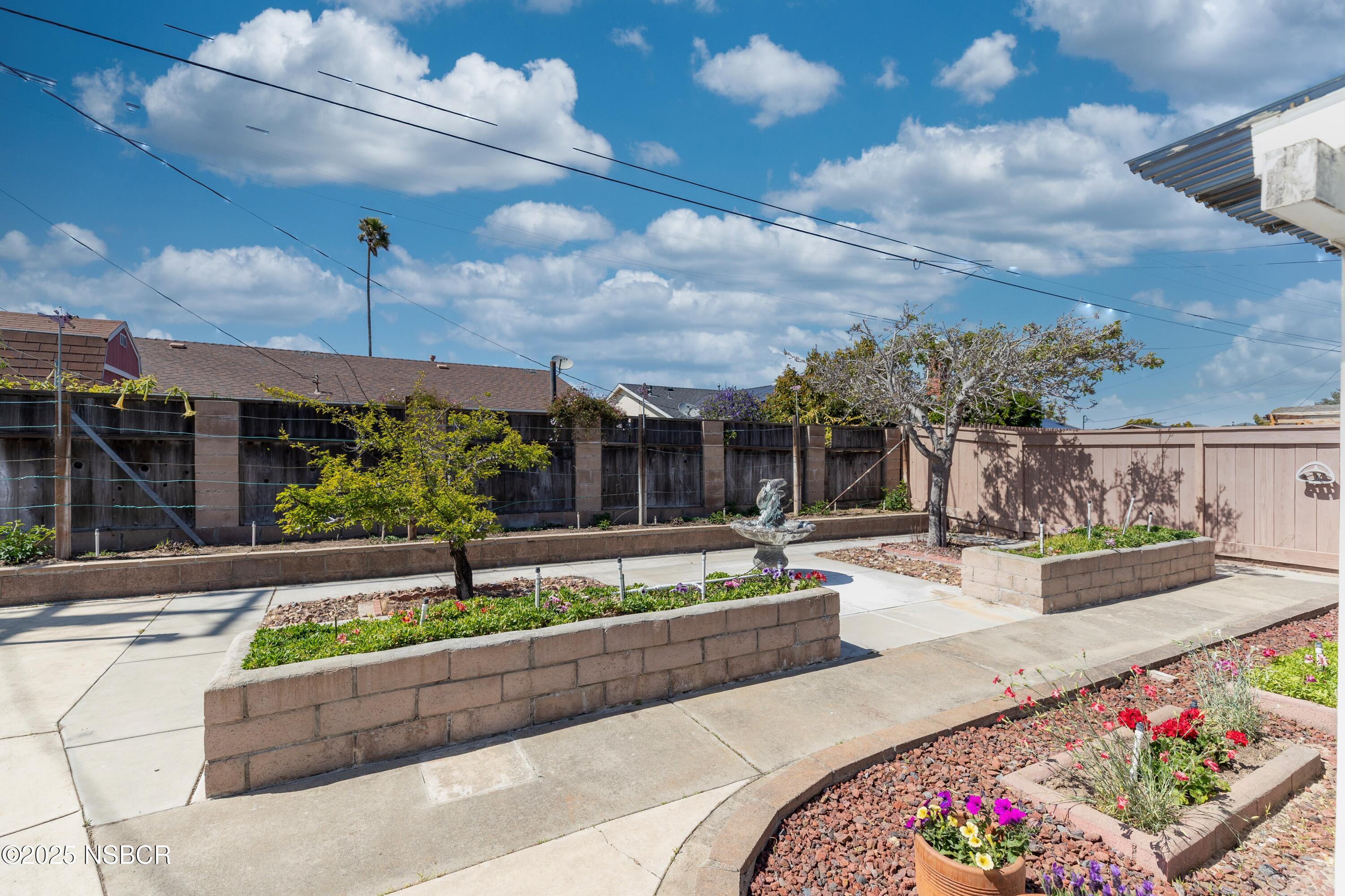 3361 Via Elba Lompoc, CA 93436 - Photo 34 of 40 a view of house with a yard and potted plants