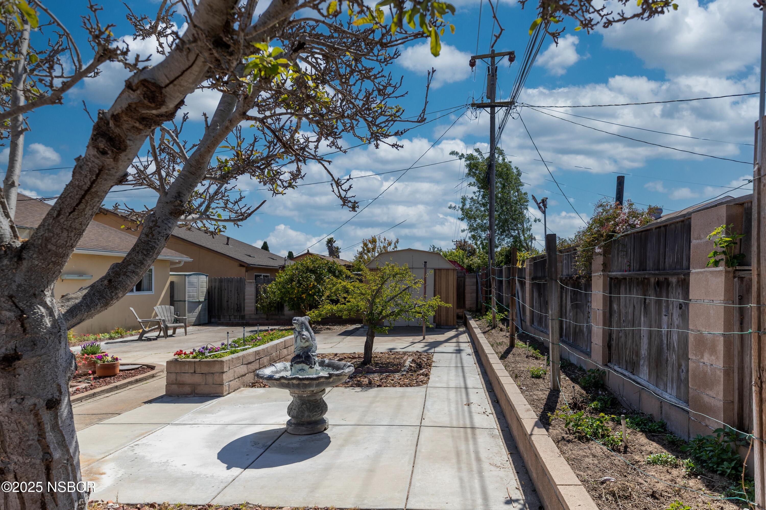 3361 Via Elba Lompoc, CA 93436 - Photo 38 of 40 a view of swimming pool with seating space and trees in the background