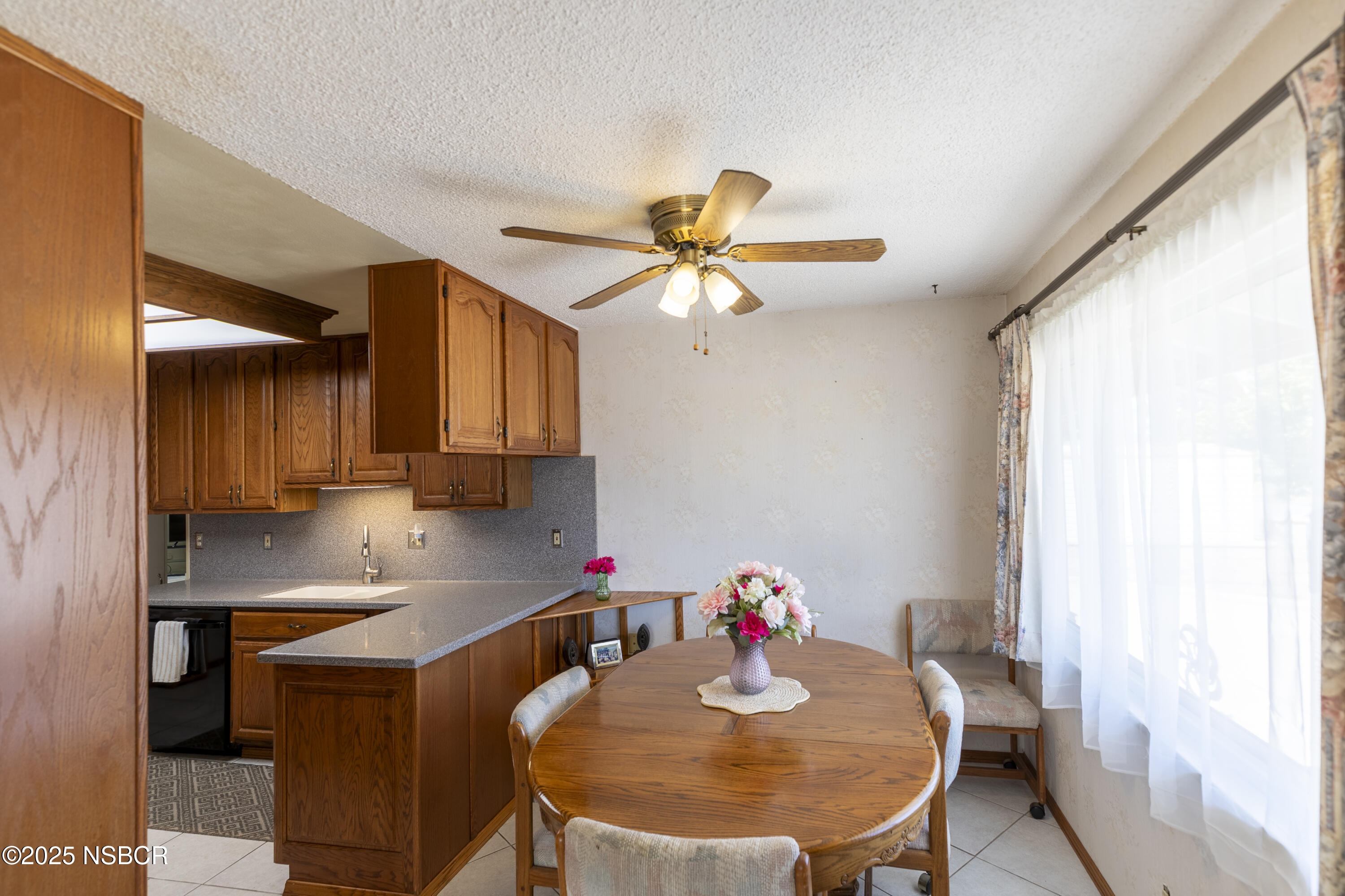 3361 Via Elba Lompoc, CA 93436 - Photo 7 of 40 a kitchen with a sink cabinets and window