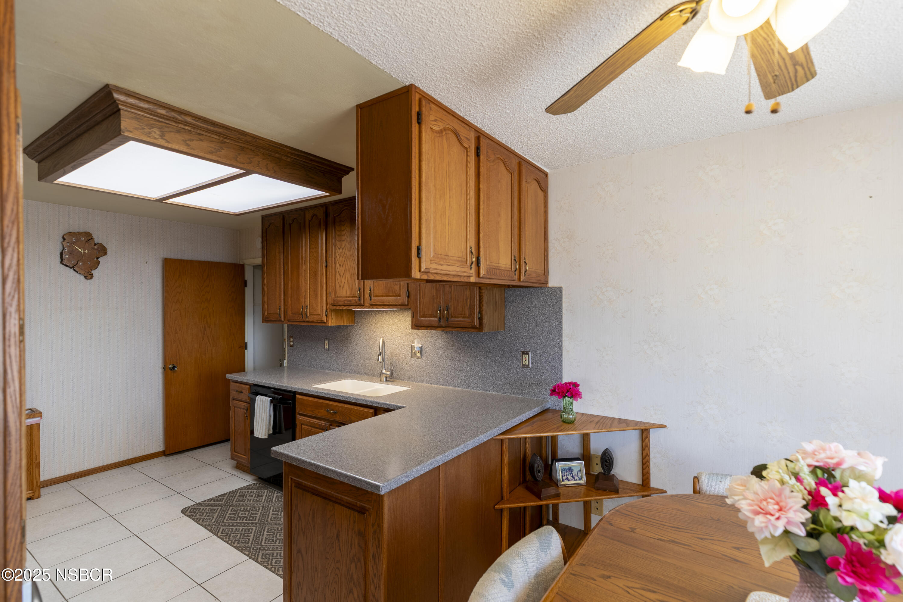 3361 Via Elba Lompoc, CA 93436 - Photo 8 of 40 a kitchen with stainless steel appliances granite countertop a sink dishwasher and a refrigerator with wooden floor
