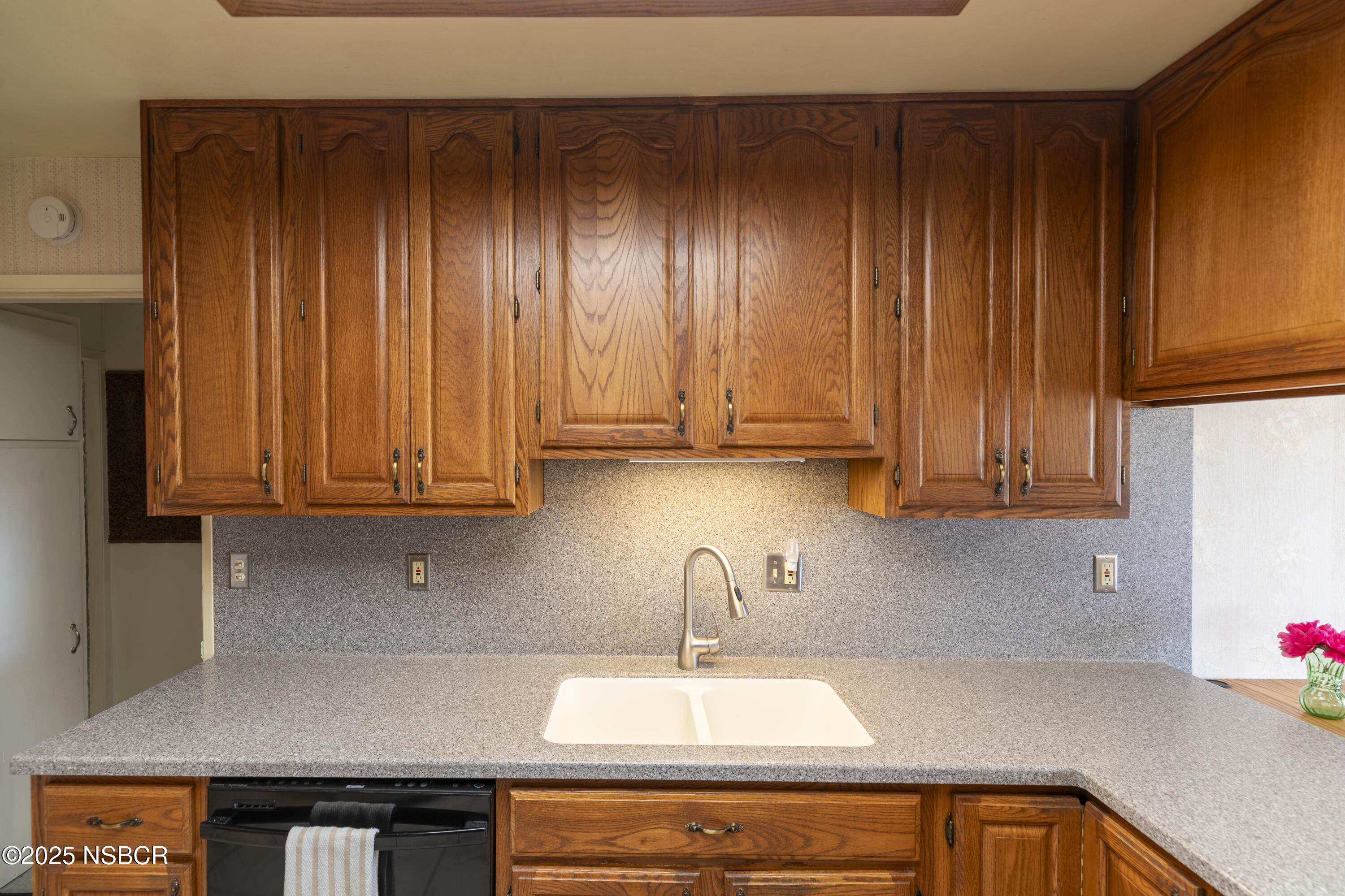 3361 Via Elba Lompoc, CA 93436 - Photo 9 of 40 a kitchen with a sink cabinets and window