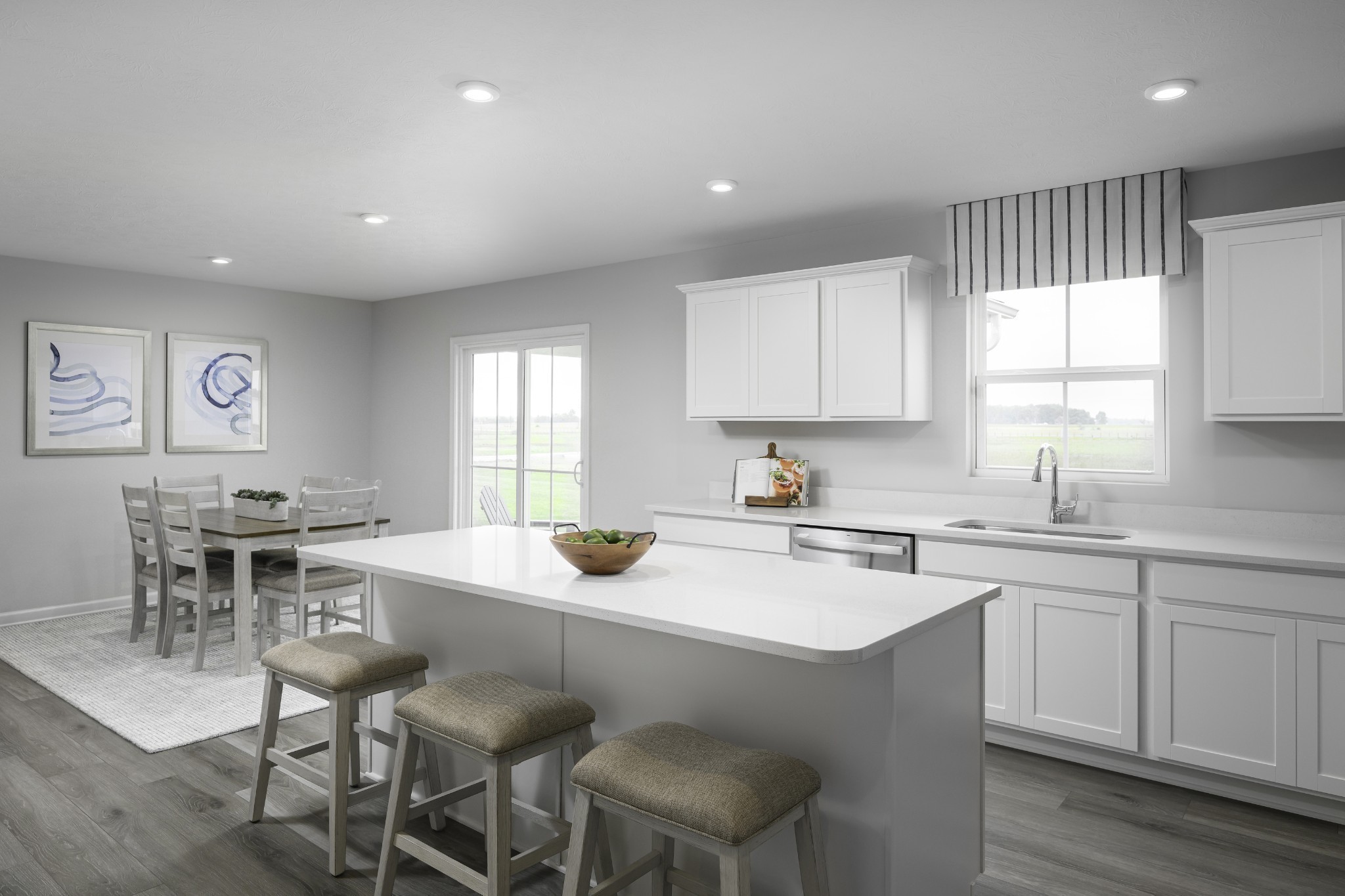 244 Laurel Street Gallatin, TN 37066 - Photo 2 of 17 a kitchen with a dining table chairs sink and cabinets