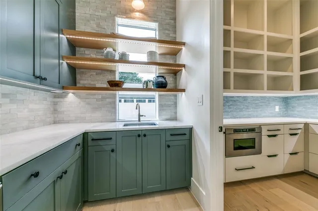 a kitchen with a sink and cabinets
