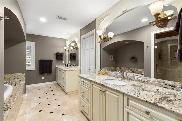 a bathroom with a sink double vanity and a mirror