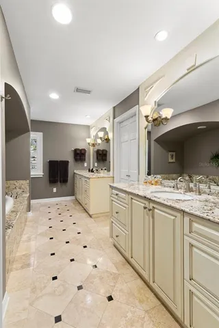 a large white kitchen with a large window