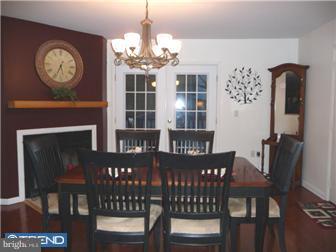 75 Falmouth Road Hamilton, NJ 08620 - Photo 3 of 12 a view of a dining room with furniture a chandelier and wooden floor