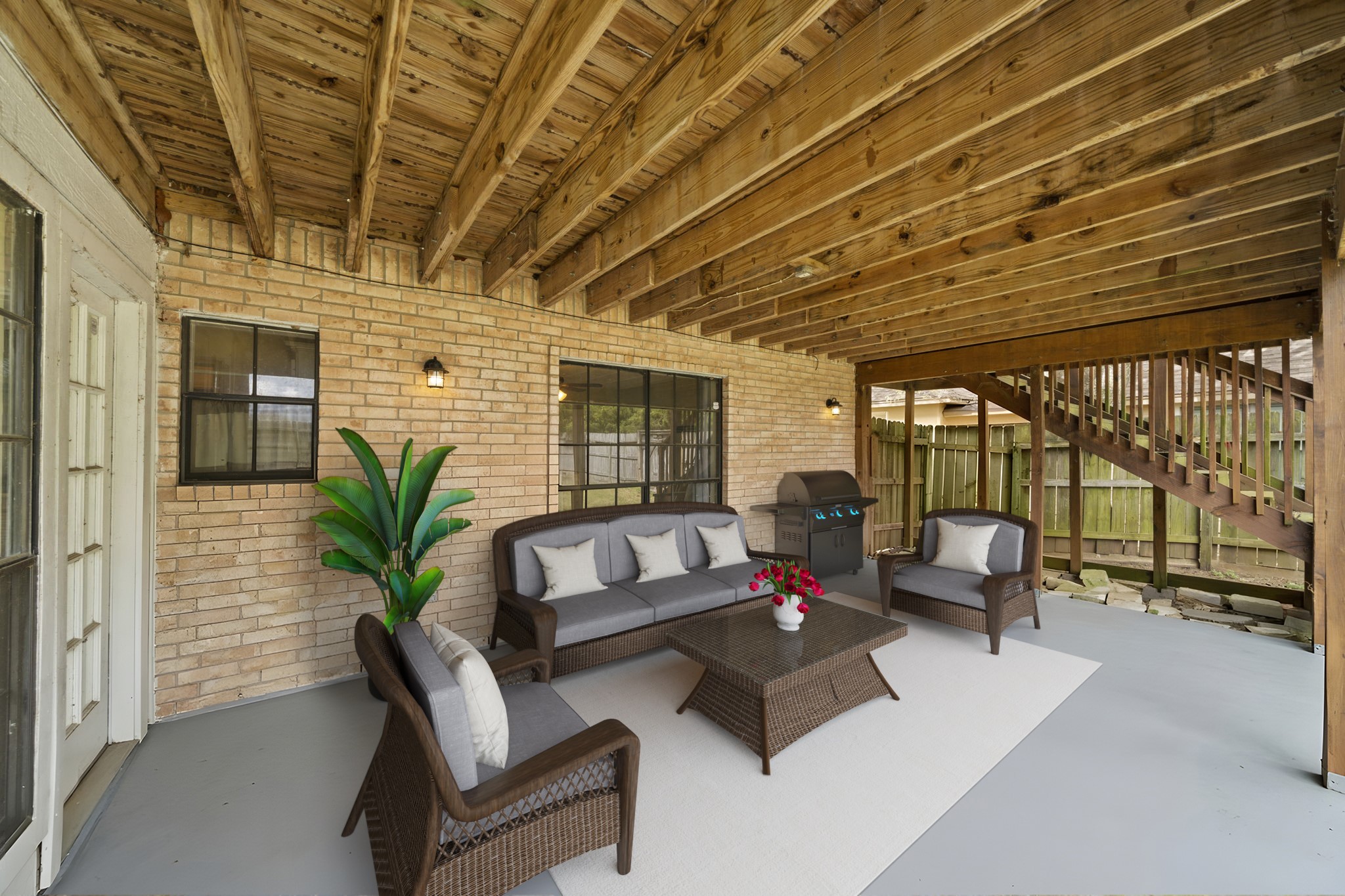 169 April Cove Montgomery, TX 77356 - Photo 31 of 39 Virtually Staged: Enjoy the great outdoors in this amazing covered patio. There are multiple seating areas, a built-in grill, and easy access between levels.