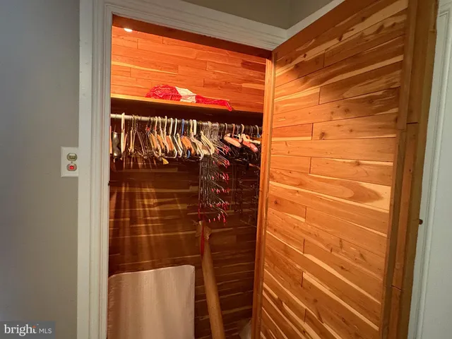 a view of living room with furniture and a fireplace