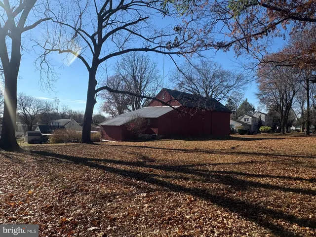a view of a yard with car parked