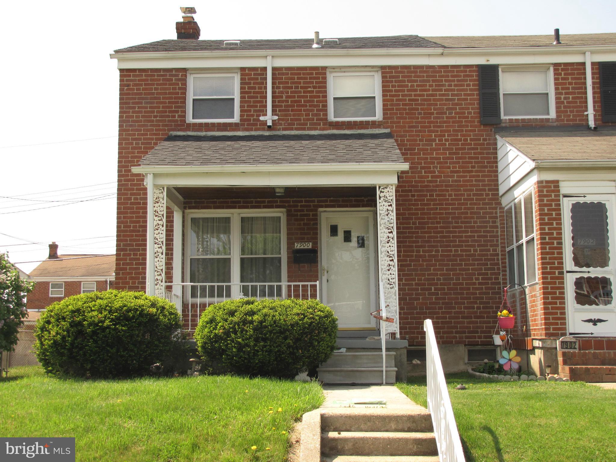 7900 Charlesmont Road Baltimore, MD 21222 - Photo 1 of 18 a front view of a house with a yard
