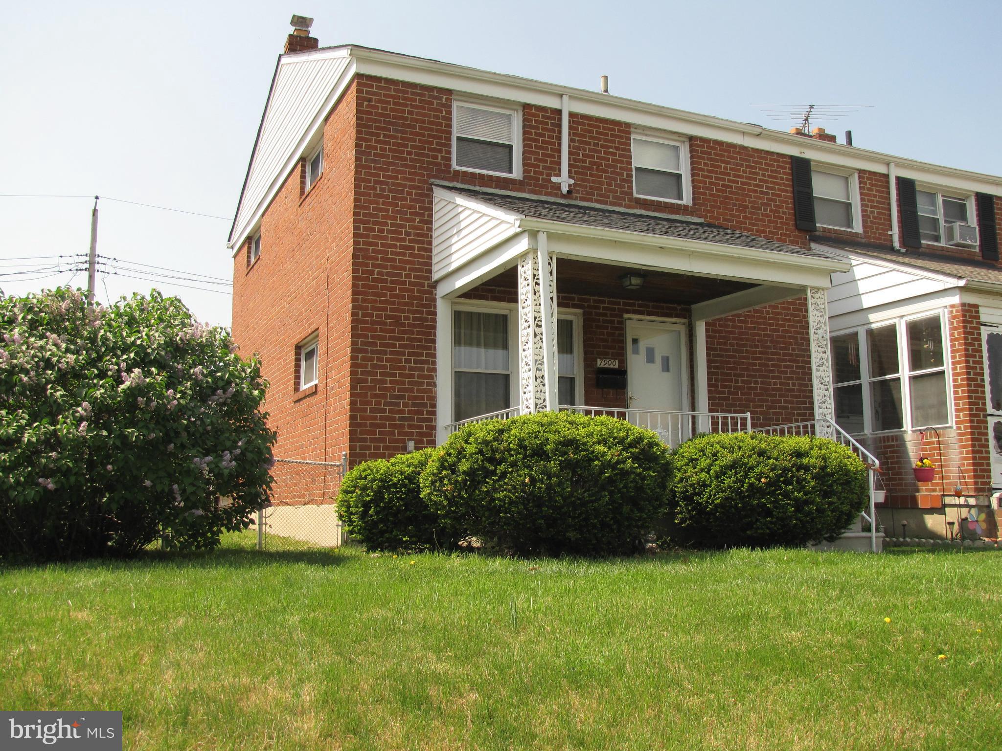 7900 Charlesmont Road Baltimore, MD 21222 - Photo 3 of 18 a front view of a house with garden
