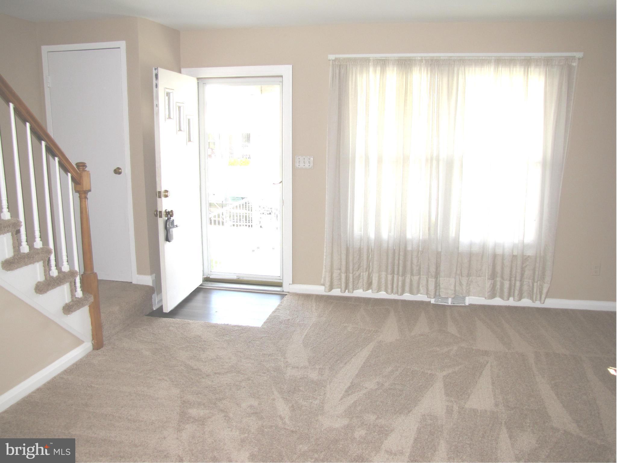 7900 Charlesmont Road Baltimore, MD 21222 - Photo 4 of 18 a view of an empty room with a window