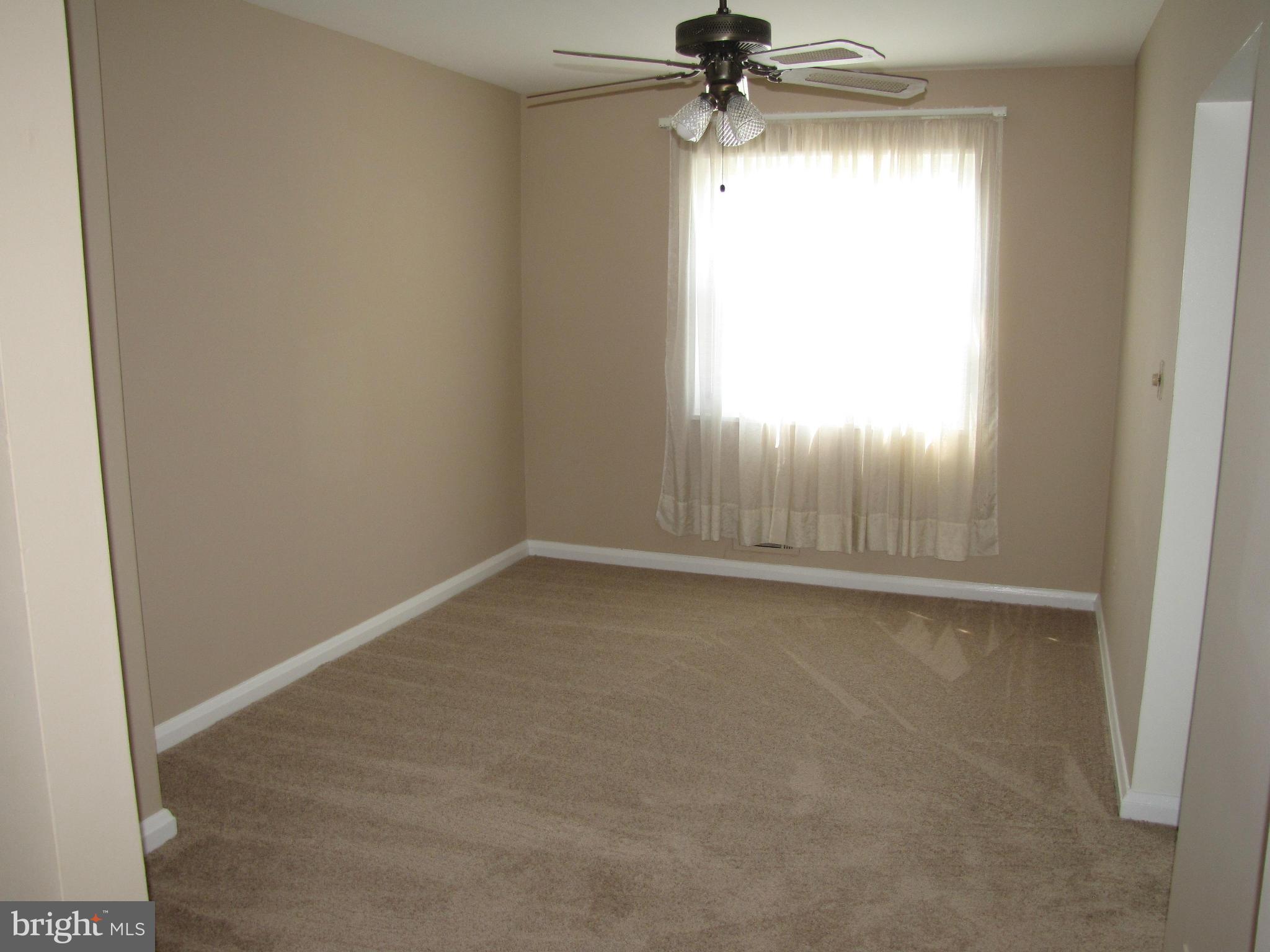 7900 Charlesmont Road Baltimore, MD 21222 - Photo 5 of 18 an empty room with a window