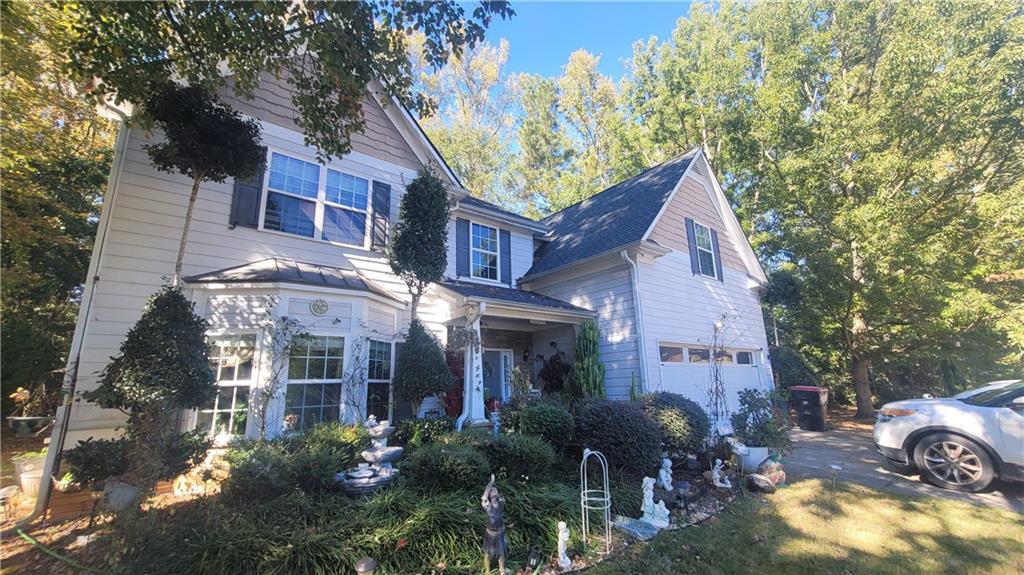 a view of a house with brick walls and plants