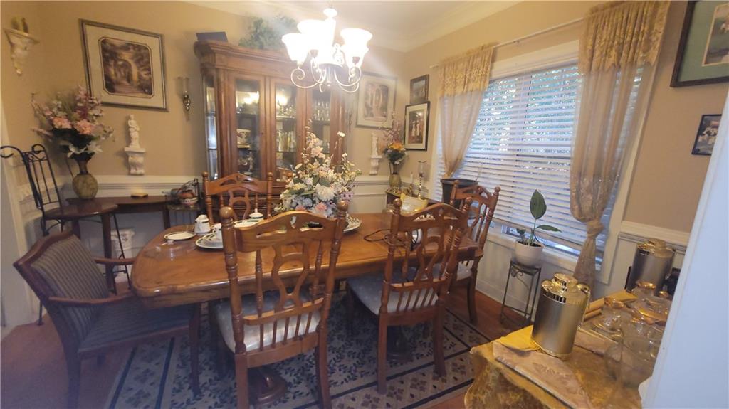 2182 Ann Lane Lithia Springs, GA 30122 - Photo 6 of 8 a view of a dining room with furniture and chandelier