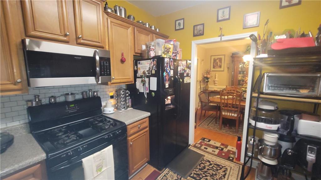 2182 Ann Lane Lithia Springs, GA 30122 - Photo 8 of 8 a kitchen with a sink stove and refrigerator