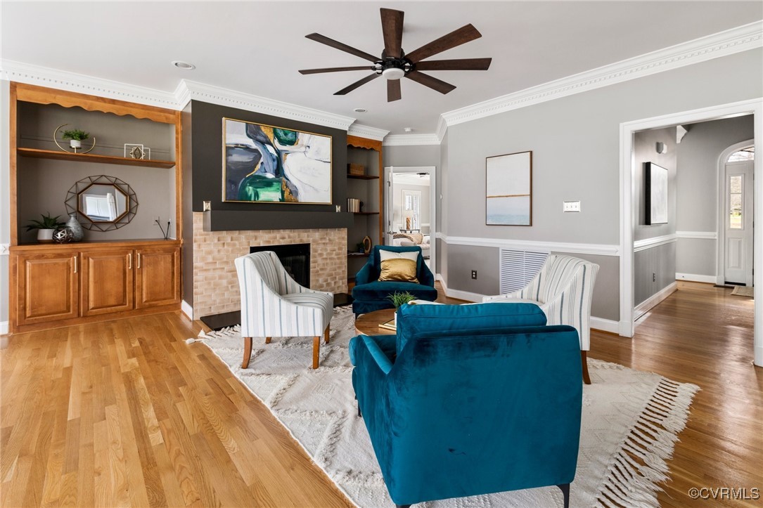 2311 Kings Lynn Road Midlothian, VA 23113 - Photo 19 of 50 a living room with furniture and a wooden floor