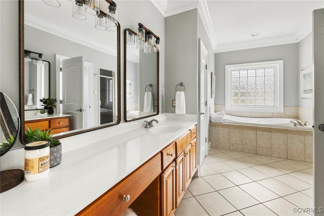 2311 Kings Lynn Road Midlothian, VA 23113 - Photo 25 of 50 a spacious bathroom with a tub sink and mirror