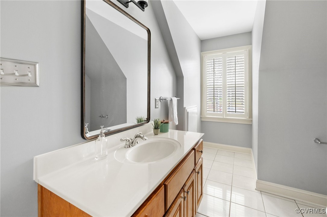 2311 Kings Lynn Road Midlothian, VA 23113 - Photo 30 of 50 a bathroom with a sink a mirror and a bathtub