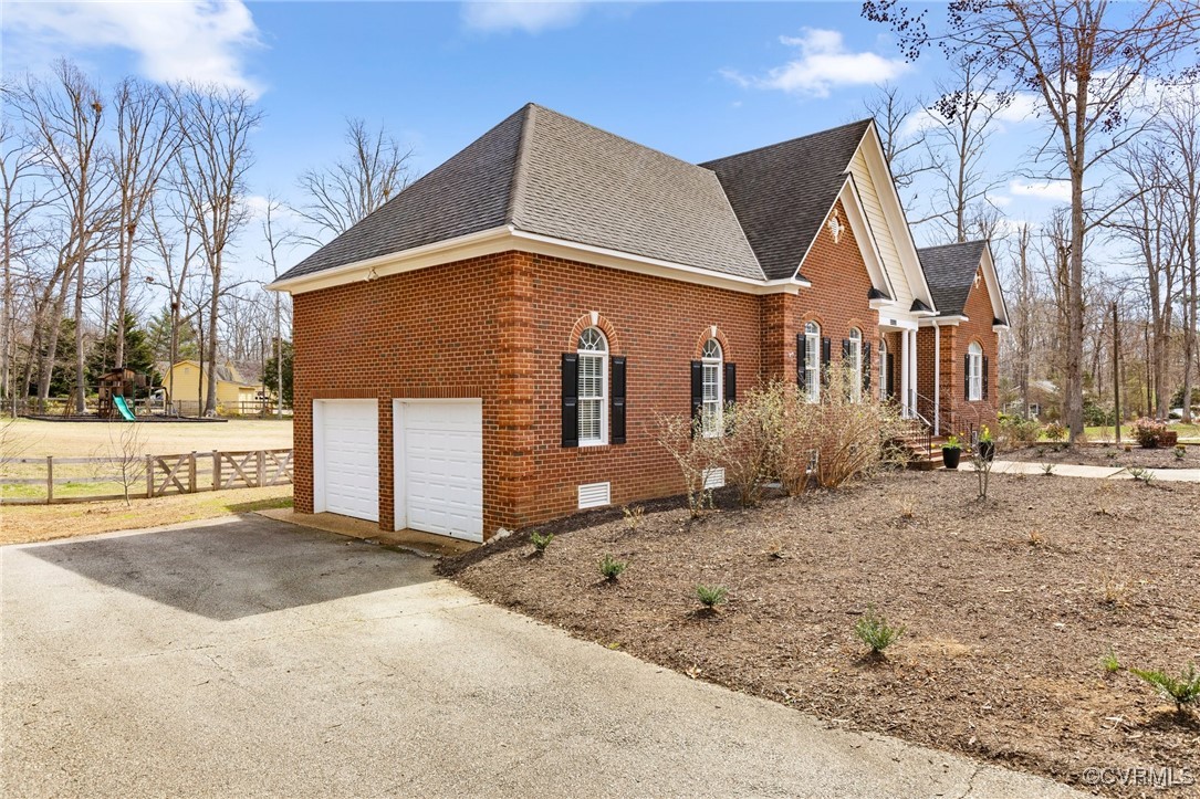 2311 Kings Lynn Road Midlothian, VA 23113 - Photo 3 of 50 a front view of a house with a yard
