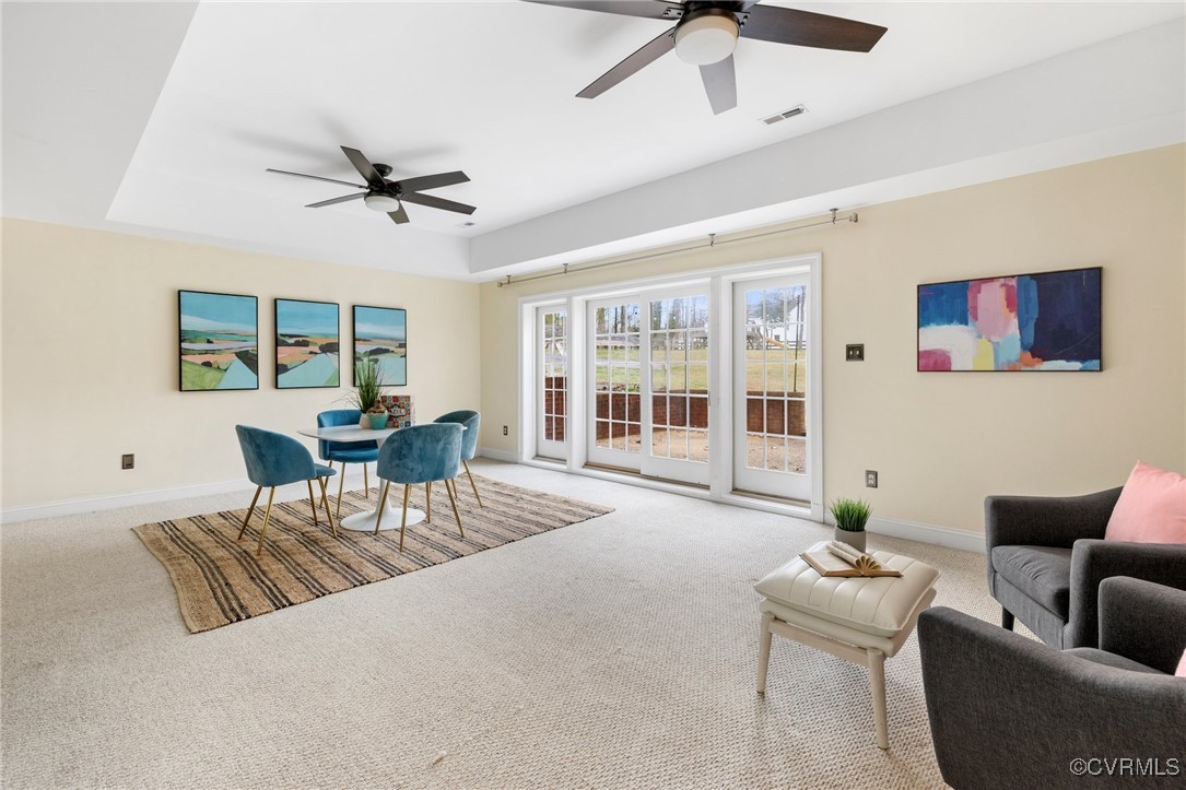 2311 Kings Lynn Road Midlothian, VA 23113 - Photo 35 of 50 a living room with furniture and a floor to ceiling window