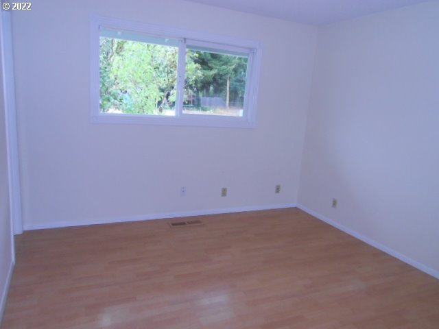 5355 Southwest River Road Hillsboro, OR 97123 - Photo 16 of 24 an empty room with a window