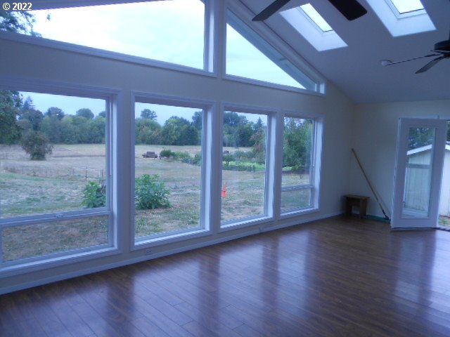 5355 Southwest River Road Hillsboro, OR 97123 - Photo 17 of 24 a view of a garden from a big room with wooden floor and windows