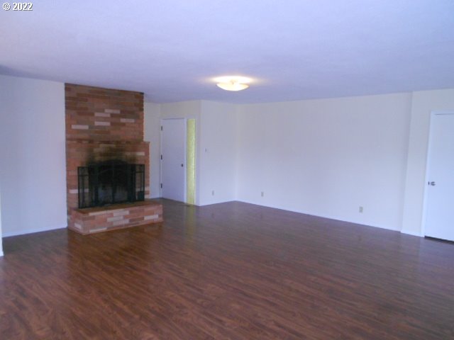 5355 Southwest River Road Hillsboro, OR 97123 - Photo 24 of 24 a view of a room with wooden floors and fireplace