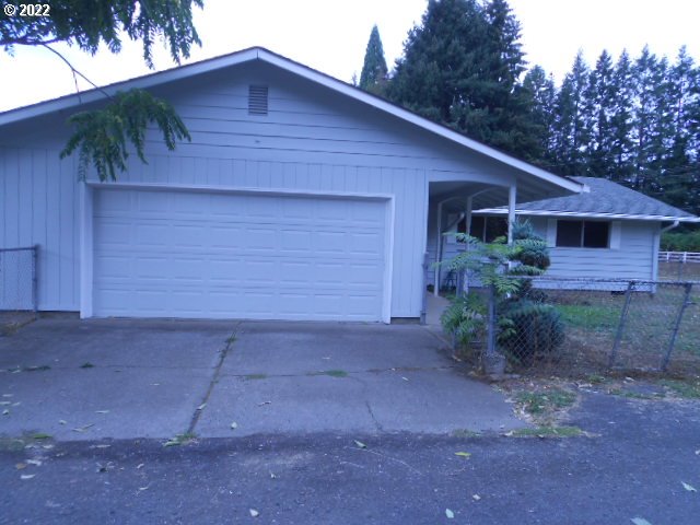 5355 Southwest River Road Hillsboro, OR 97123 - Photo 4 of 24 a front view of house with yard and trees