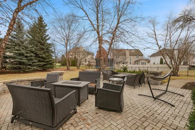 a view of a patio with iron fence