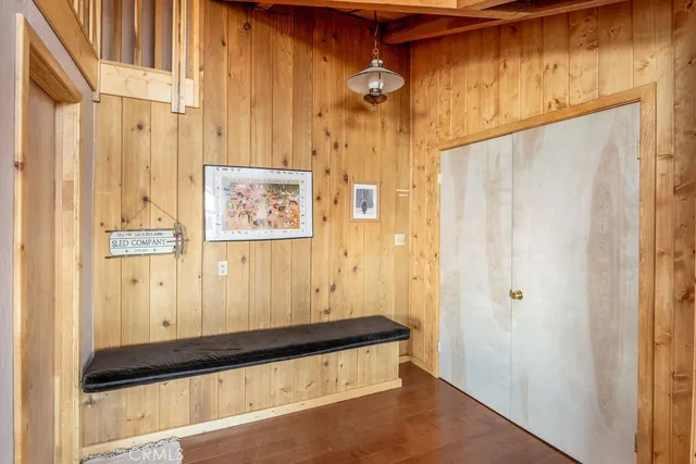 a view of an entryway with wooden floor