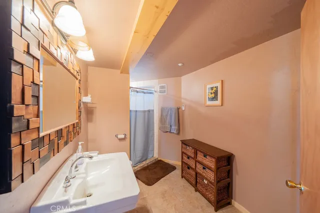 a bedroom with bed and window