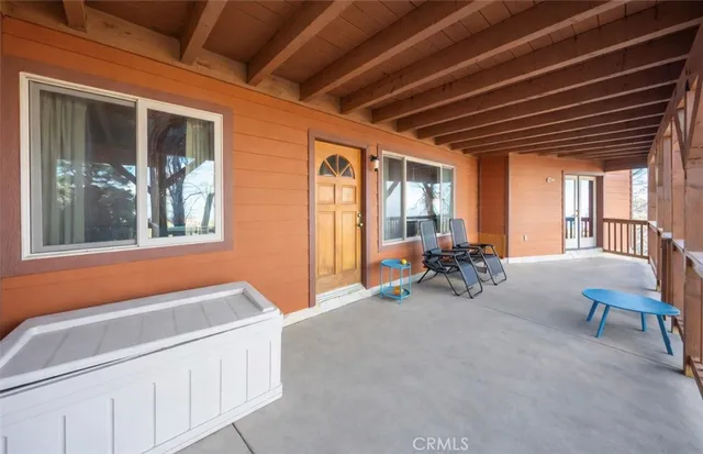 a bedroom with furniture and a rug
