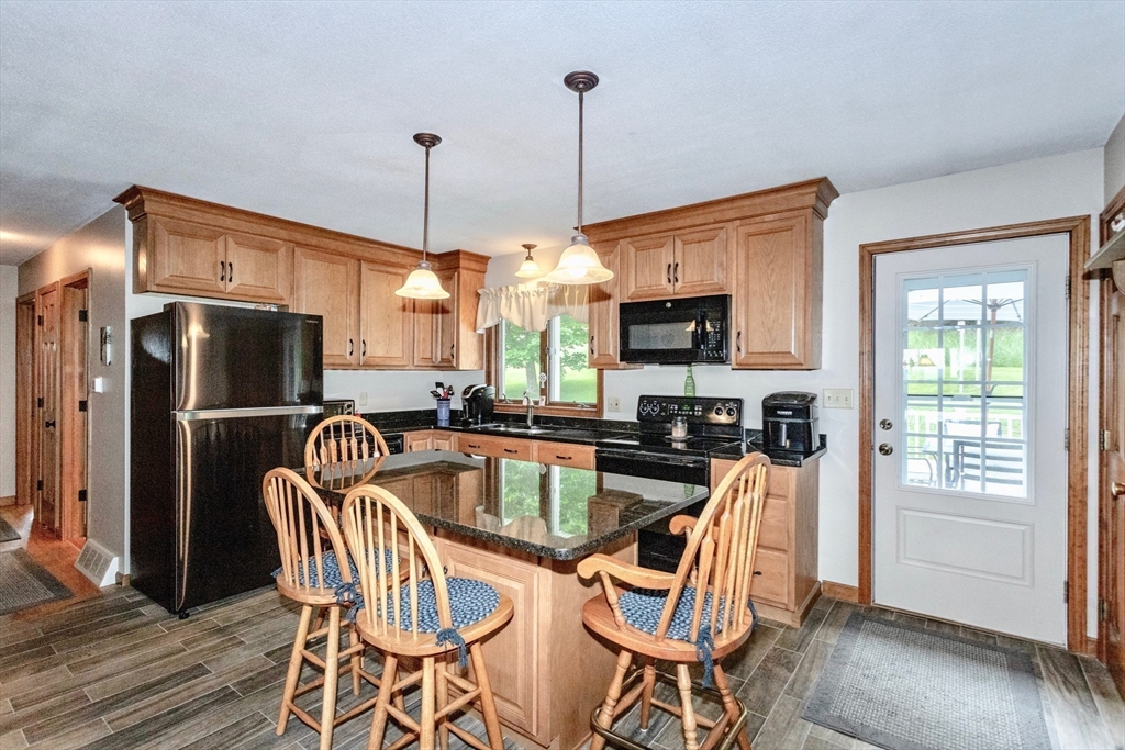 85 Lyman Road Chester, MA 01011 - Photo 6 of 34 a view of a dining room with furniture window and wooden floor
