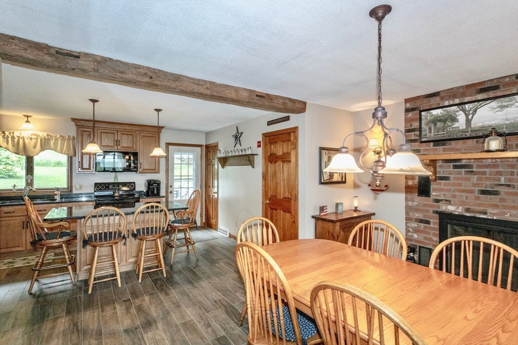 85 Lyman Road Chester, MA 01011 - Photo 10 of 34 a dining room with furniture a chandelier and wooden floor