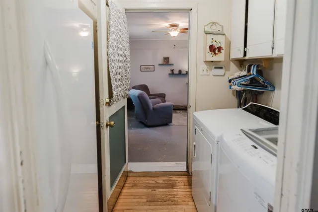 a view of hallway with livingroom and furniture