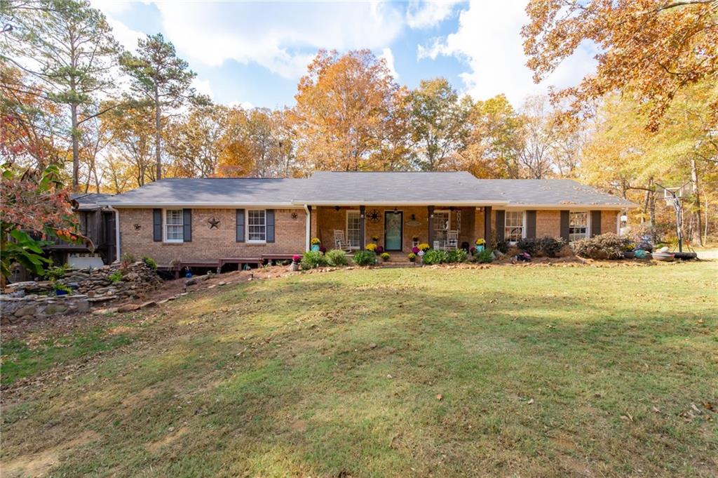 5021 North Helton Road Winston, GA 30187 - Photo 1 of 1 a front view of a house with a yard