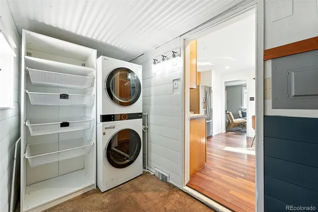 a view of a hallway with washer and dryer