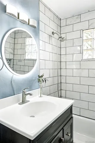 a bathroom with a sink and a mirror