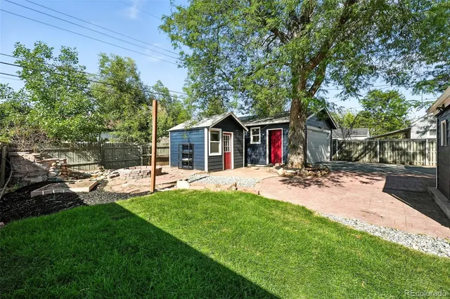 a view of a backyard with sitting area