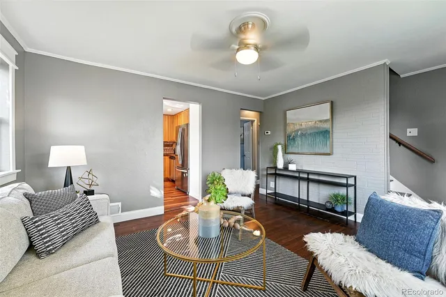 a living room with furniture and a table