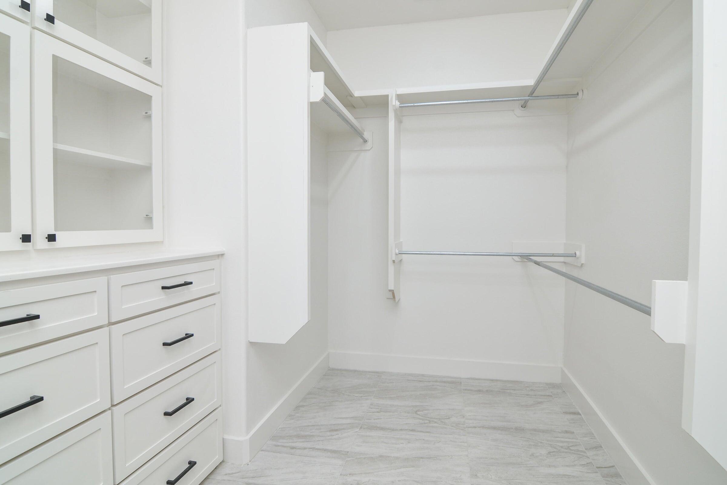 7801 56th Street Lubbock, TX 79407 - Photo 19 of 29 a view of an empty walk in closet