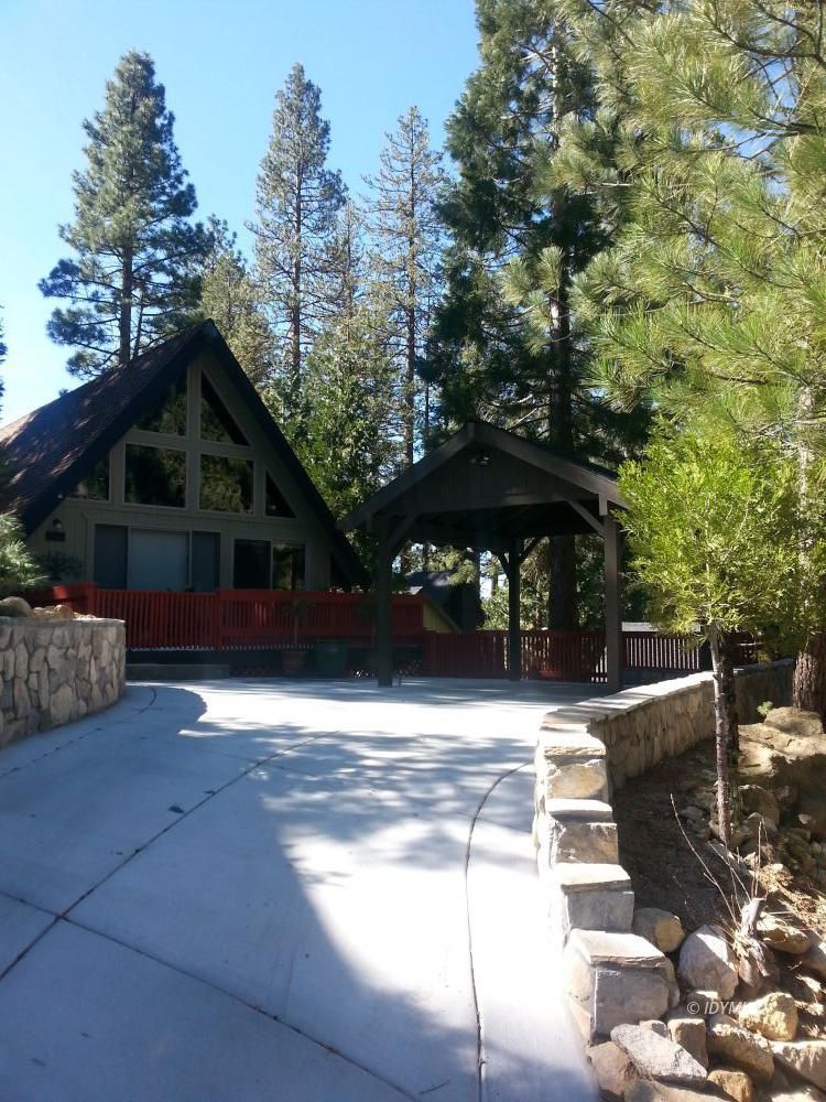 55425 Howland Road Idyllwild, CA 92549 - Photo 1 of 17 a front view of a house with yard and trees