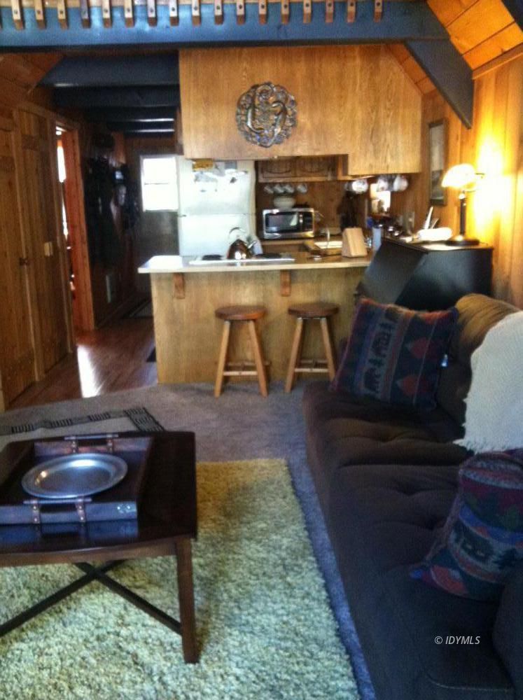 55425 Howland Road Idyllwild, CA 92549 - Photo 6 of 17 a living room with a couch and a fireplace
