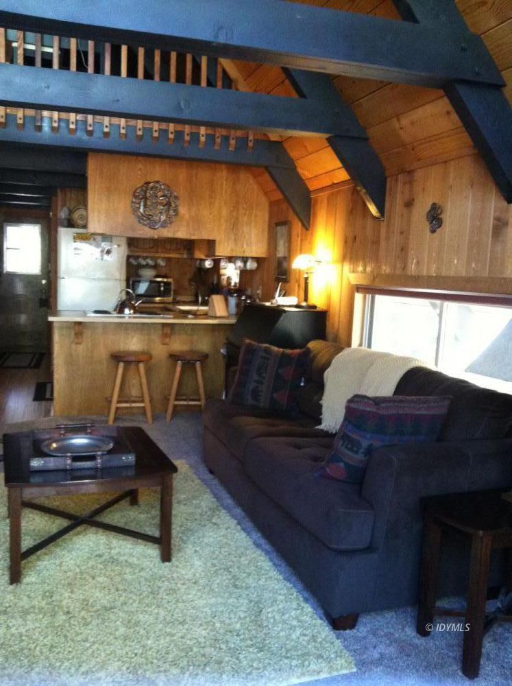 55425 Howland Road Idyllwild, CA 92549 - Photo 9 of 17 a living room with furniture a rug and a fireplace