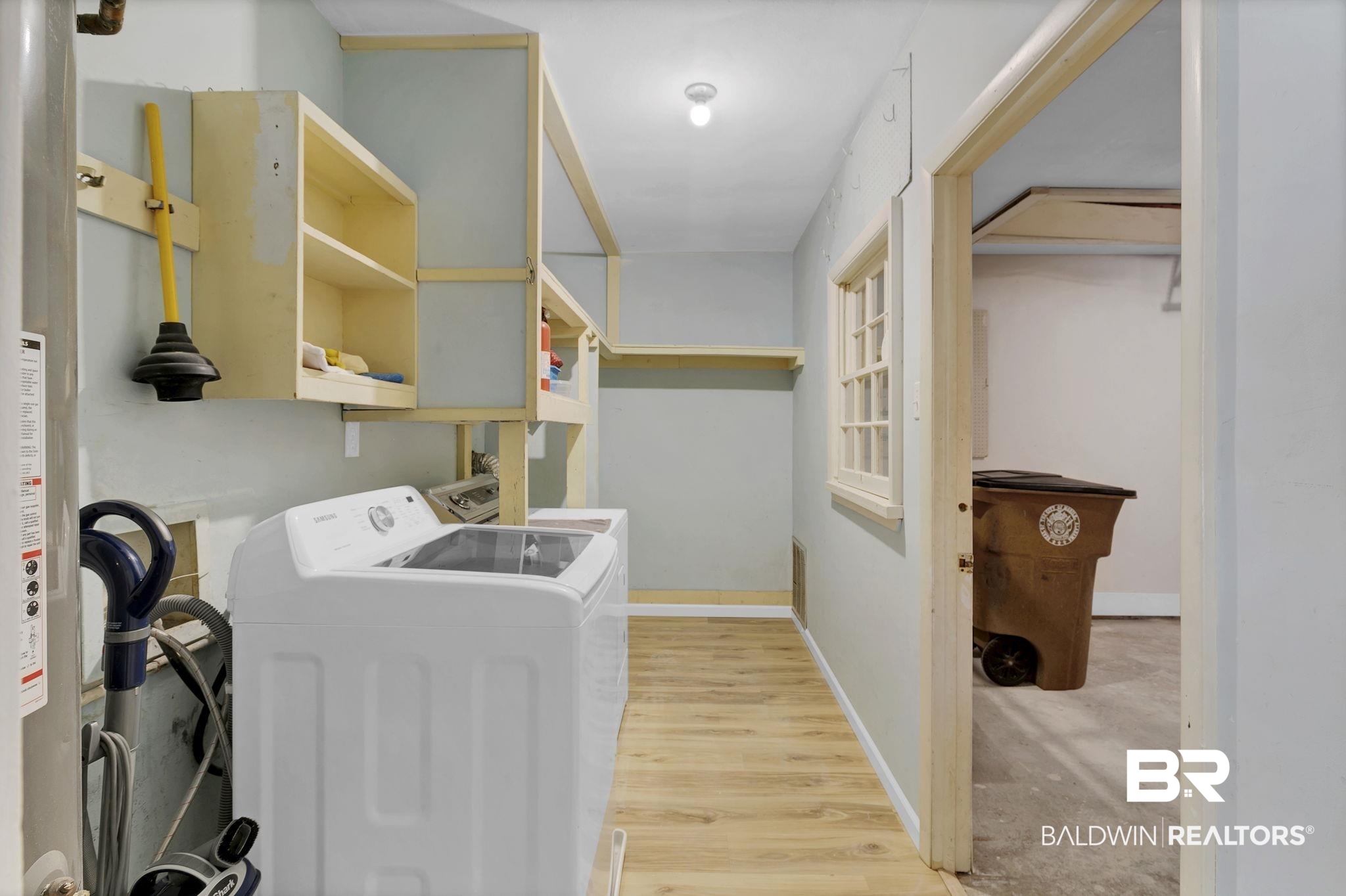 5817 Woodgate Road Mobile, AL 36609 - Photo 61 of 85 Clothes washing area featuring laundry area, light wood-style flooring, baseboards, and washer and clothes dryer