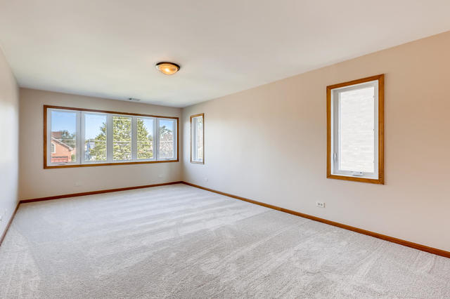 8725 West Sunset Road Niles, IL 60714 - Photo 14 of 15 an empty room with windows